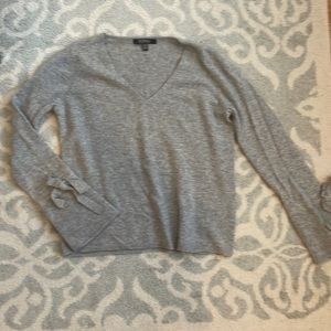 Cashmere sweater with bow tie details